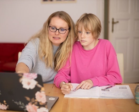 Parent working with child at home